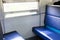 Empty chair of blue on the train.