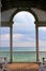 Empty chair on a deck balcony overlooking the beach and the ocean at sunset - Seaside / Florida