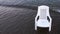 Empty chair in the sea