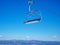 Empty chairlift on blue sky