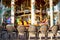 Empty chairs in front of the vintage carousel in motion at the Promenade de la Croisette in Cannes France