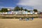 Empty chairs and wooden beach huts on the coastline. Walton on the Naze  Essex