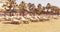 Empty chaise lounges on a cyprus beach