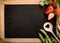 Empty Chalkboard with Asparagus, Berries and Ladle