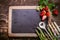 Empty Chalkboard with Asparagus and Strawberries