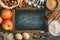 Empty chalkboard and ingredients for baking