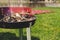 Empty charcoal grill with smoke closeup. Barbecue outdoor.