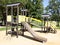 Empty children playground with steel wooden slide and climbing bars activities in public green park modern