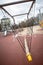 An empty children`s playground with playground equipment in the city park, fenced with warning tapes in red and white