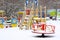 Empty children`s playground in snow