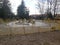 Empty childrens playground in local park on rainy day.