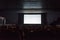 Empty cinema screen with audience