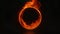 Empty circular frame with fire flames on dark background.
