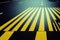 Empty city asphalt road background with pedestrian crossing under traffic lights closeup directly above view. Urban