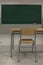 Empty class, blackboard, table and chair