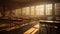 an empty classroom in the soft light of dawn, where the sun peeks through partially open blinds