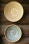 Empty clay bowls on a wooden background. Top view. Authentic bowls of Belarus