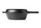 Empty, clean black cast iron pan or dutch oven side view over white