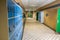 Empty clean hallway corridor classroom with colored furniture lockers and door room at school or university in germany