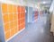 Empty clean hallway corridor classroom with colored furniture lockers and door room at school or university in germany
