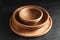 Empty clean wooden dishware on black table, closeup