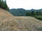 An empty clearing near Wilder, Idaho with a clear view of mountains all around,.