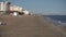 Empty closed for winter beach cafes during off-season. Beach umbrella`s sticks and lifeguard`s tower