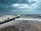 Empty coast stormy Baltic sea under dramatic sky