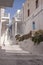 Empty cobbled streets, whitewashed buildings in Mykonos, Greece