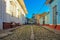 Empty cobblestone street with colonial colorful houses in Trinidad, Cuba. Beautiful Caribbean cityscape. UNESCO site famous