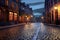 empty cobblestone street with street lamps glowing