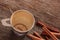 Empty coffee cup with Cinnamon after drink on wood table.