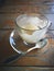 Empty coffee cup with cookies on wooden table in cafe