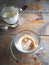 Empty coffee cup with cookies on wooden table in cafe
