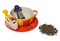 Empty coffee, tea cup with purple silver infuser in the shape of a girl on a chain. Storage on candy and two sweets, spilled tea.