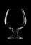 Empty cognac glass on black background studio shot
