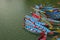 Empty colored wooden boats on the lake