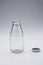 Empty colorless glass bottle