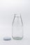 Empty colorless glass bottle