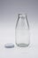 Empty colorless glass bottle