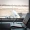 Empty comfortable armchair at the waiting hall in airport terminal, focus on the seats, vacation concept, passenger