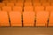 Empty concert hall, theater chairs background ... color photo, empty cinema or concert hall. The red chairs in the