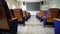 Empty conference hall with chairs and large board on wall