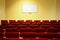 Empty conference hall with screen. rows of chairs