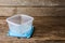 Empty containers for food on wooden background