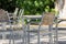 Empty contemporary tables and chairs outside a bar restaurant.