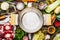 Empty cooking pot with cooking ingredients for meat soup or broth on kitchen table