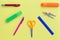 Empty copy space for your text in the semicircle frame of school supplies as pens, pencils, ruler, scissors, sharpener, marker