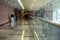 Almost empty corridor in a modern hospital or in a modern office building. Blurred background. Horizontal view