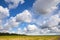 Empty country landscape with cloudy sky